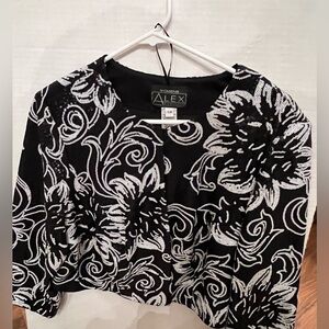 ALEX EVENING BOLERO JACKET. SIZE 16 W
BLACK/WHITE SCOOP NECKLINE